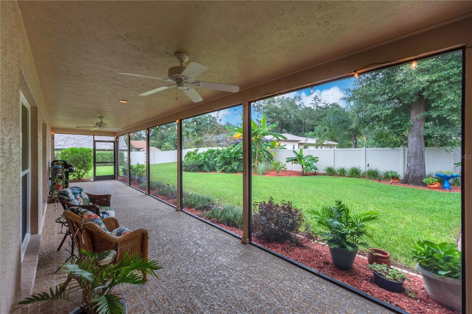This extended lanai is perfect for enjoying the outdoors in comfort. - 2421 OAK LANDING DR, BRANDON