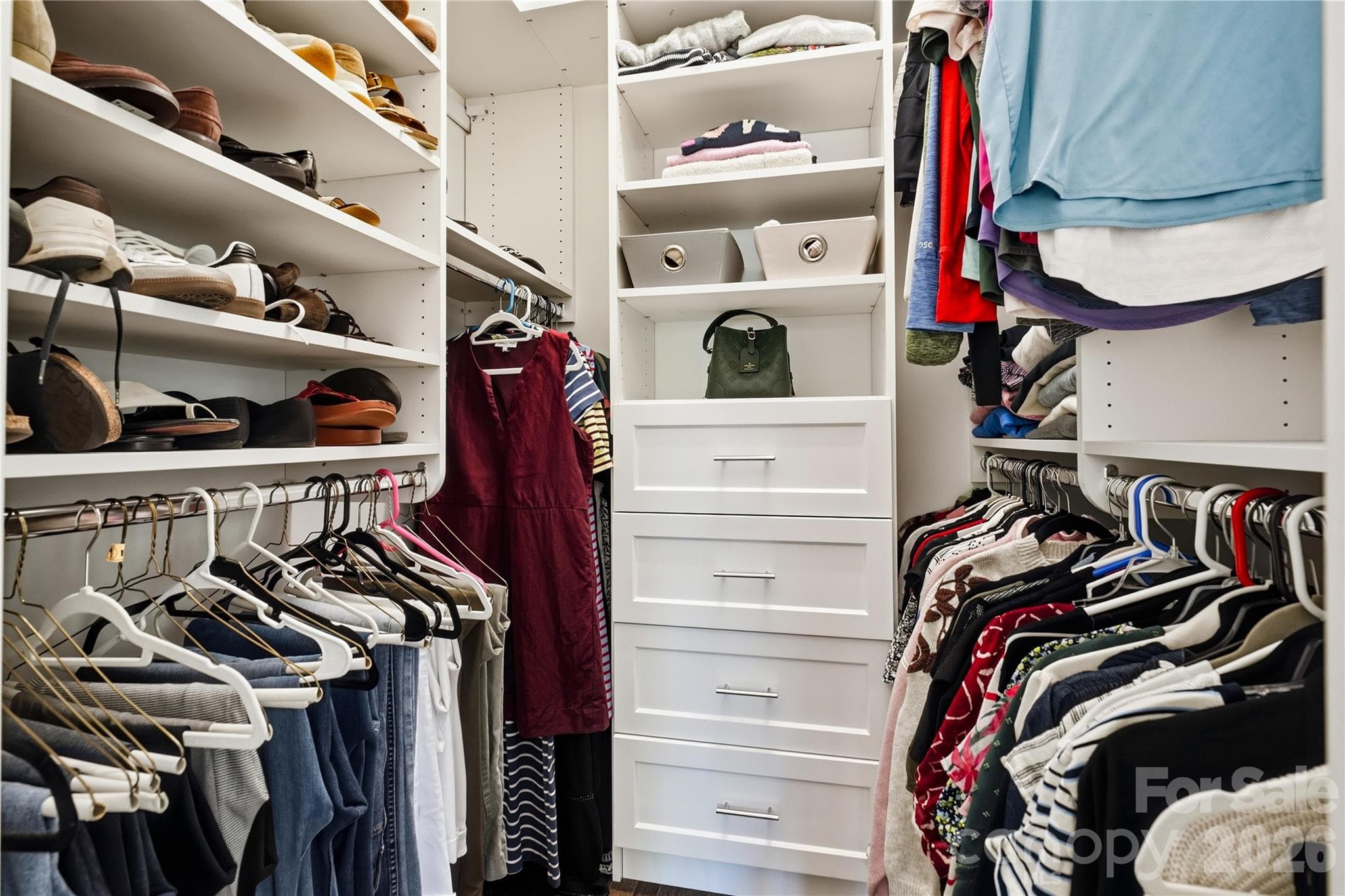 Primary walk-in closet features new closet systems - 16918 Summers Walk Boulevard, Davidson
