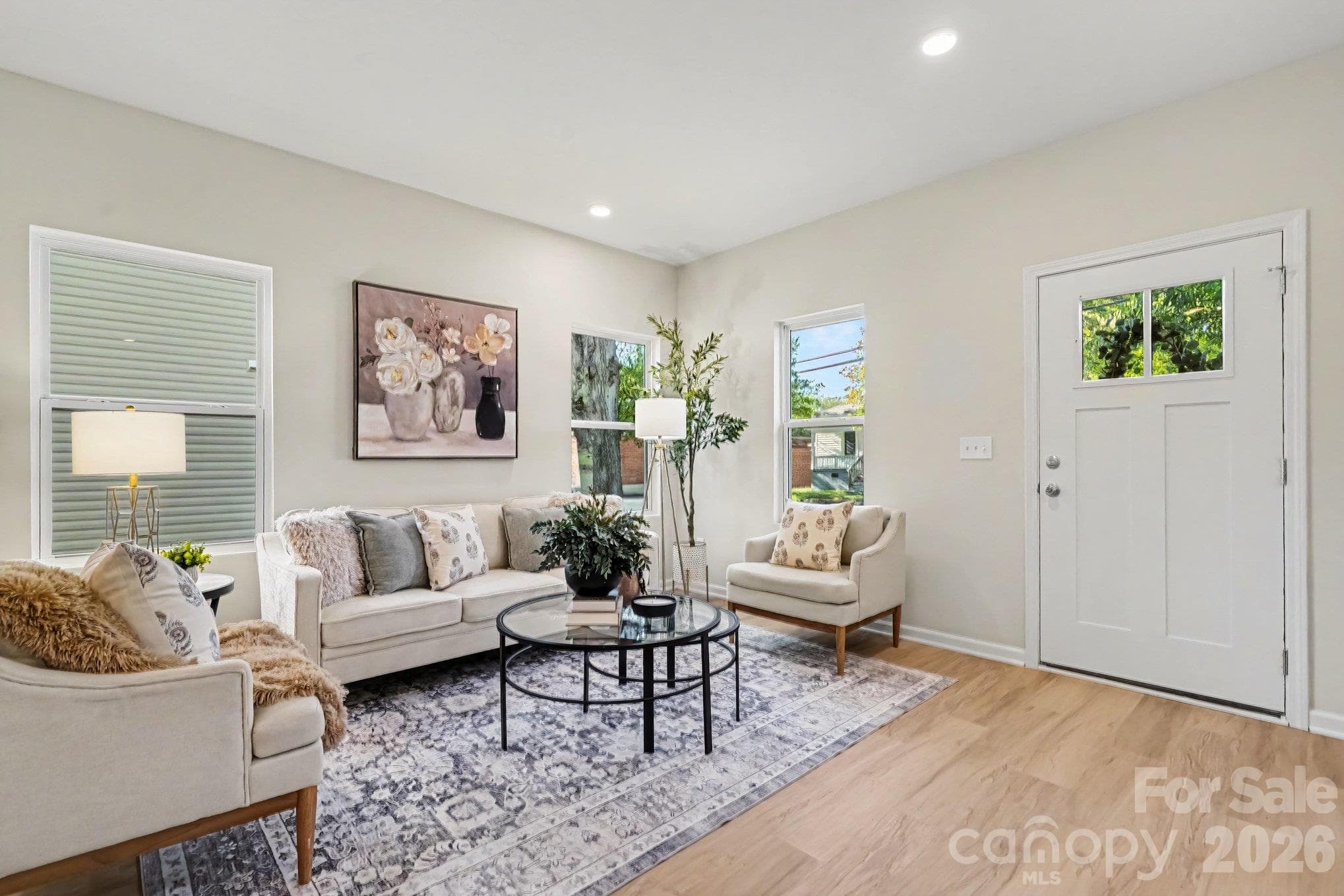 Great room is open to dinning area and kitchen. Recessed lighting in ceiling. This photo is a representation of home taken from identical home next door. - 125 Buffalo Avenue NW, Concord