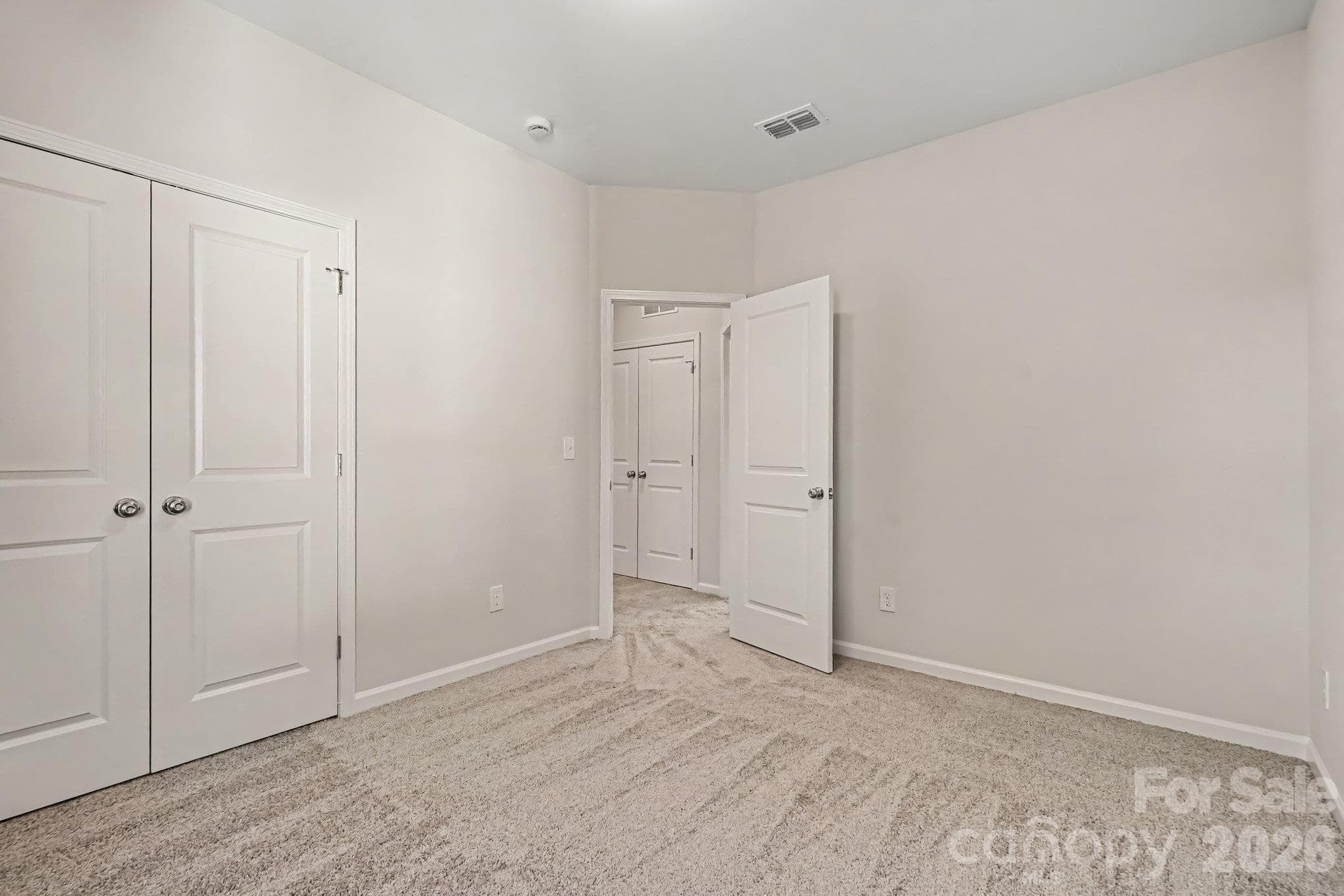 This is a view from one of the bedrooms looking into the hallway where the laundry closet is located. This photo is a representation of home taken from identical home next door. Actual photos are in process. - 125 Buffalo Avenue NW, Concord