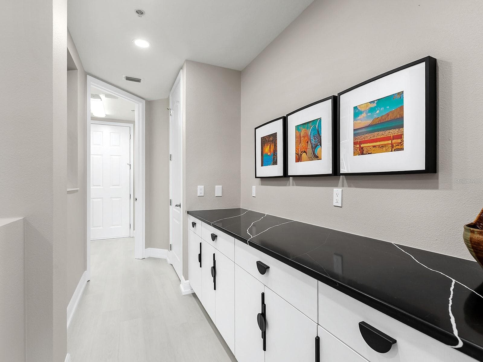 Hallway Leading to Laundry Room & 2-Car Garage - 6527 MOORINGS POINT CIR #101, LAKEWOOD RANCH