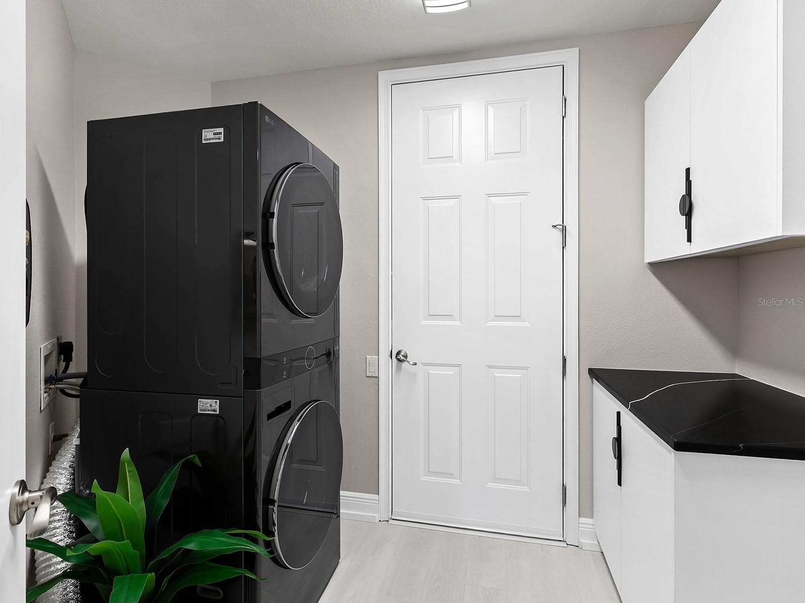 Laundry Room with a Folding Area and Newer W/D in 2025 - 6527 MOORINGS POINT CIR #101, LAKEWOOD RANCH