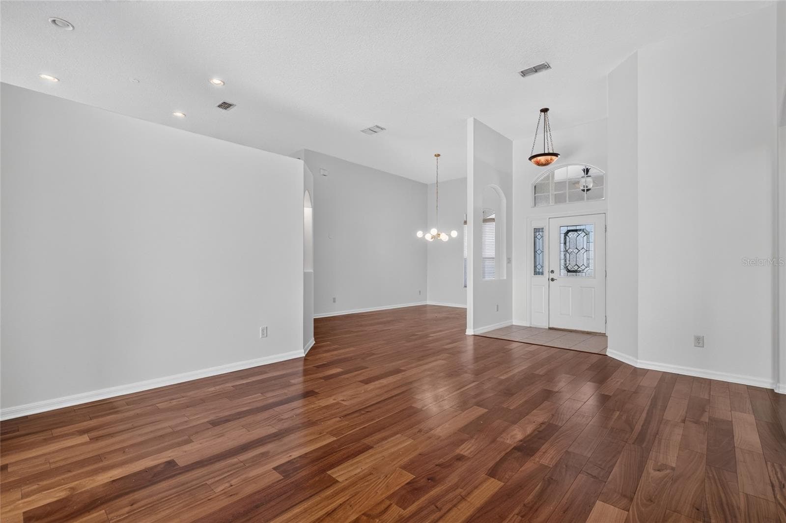 VIEW FROM THE LIVING ROOM SHOWING THE DINING ROOM AND ENTRY WAY - 24151 BELLE MEDE DR, LEESBURG
