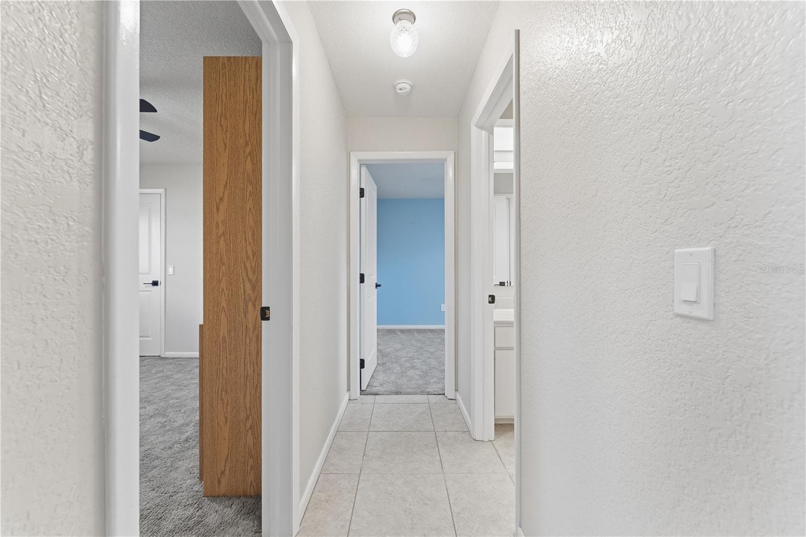 BACK BEDROOMS AND BATH ON RIGHT - 1478 NAVIGATOR RD, PUNTA GORDA