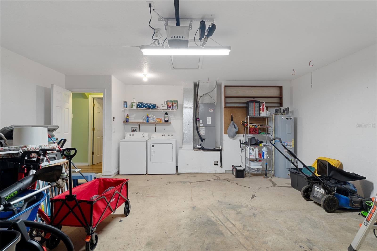 laundry in garage - 513 OAKHILL CT, BROOKSVILLE