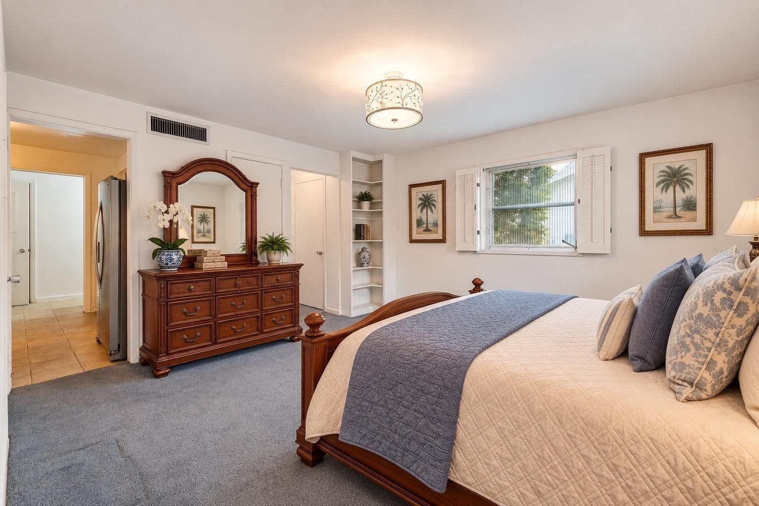 Virtual Staged, 1st Floor Primary Bedroom features a built in book shelves and 2 closets with ensuite bathroom - 803 HILLSIDE AVE, LAKE WALES