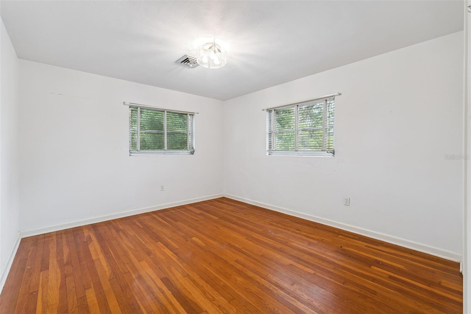 Bedroom #3 features hardwood flooring - 803 HILLSIDE AVE, LAKE WALES