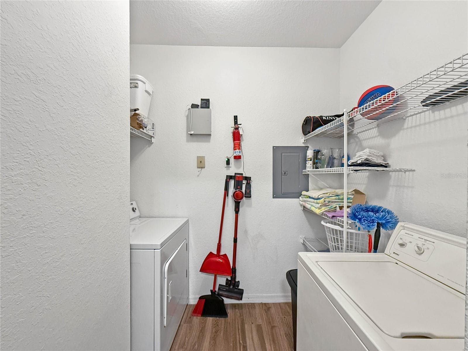Laundry and storage room off kitchen - 8815 DUNES CT #105, KISSIMMEE
