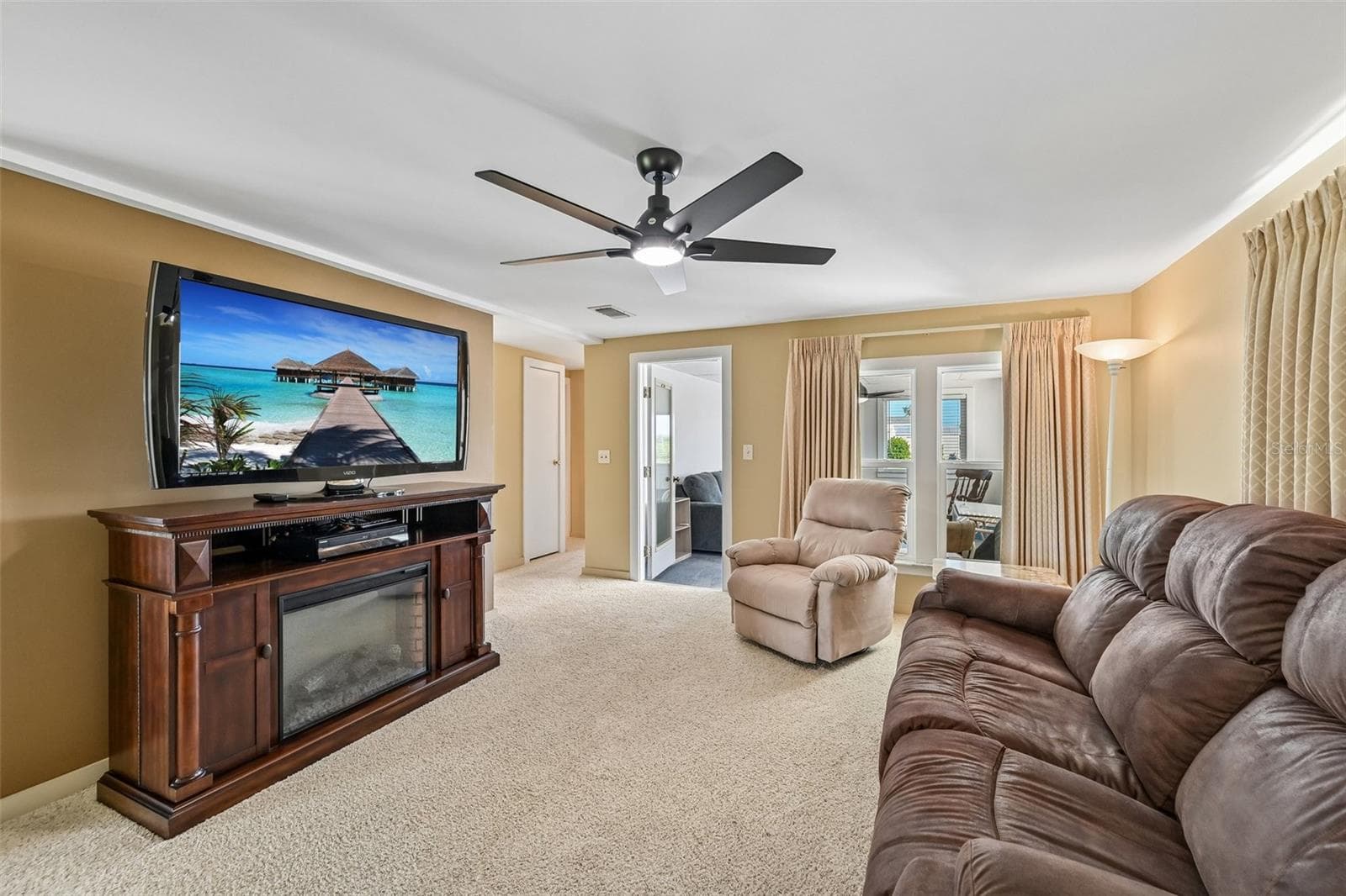 Living Room with access to Florida Room. Lots of windows! - 8455 ALBATROSS LN, ENGLEWOOD