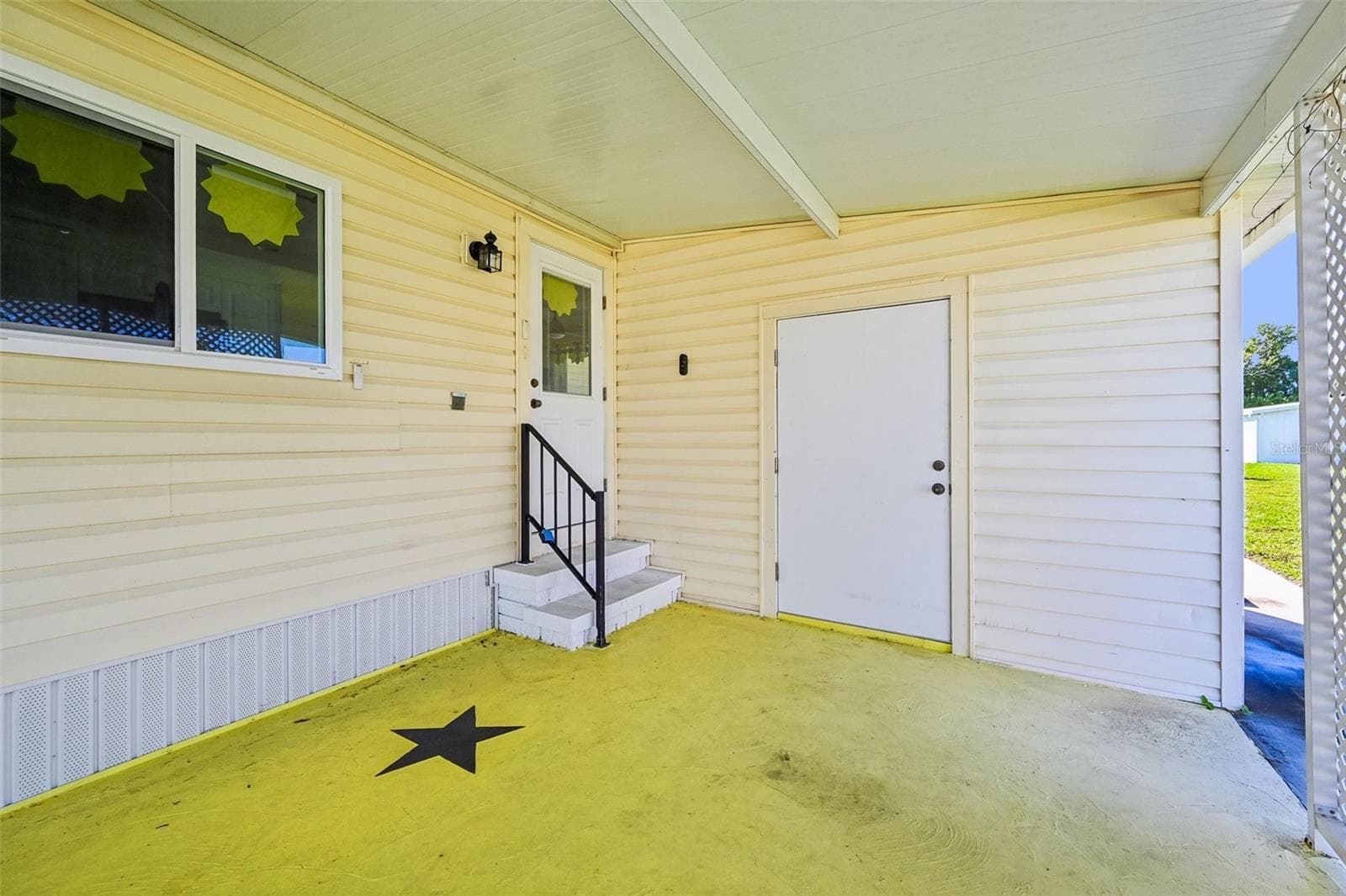 Covered carport with storage/laundry - 8455 ALBATROSS LN, ENGLEWOOD