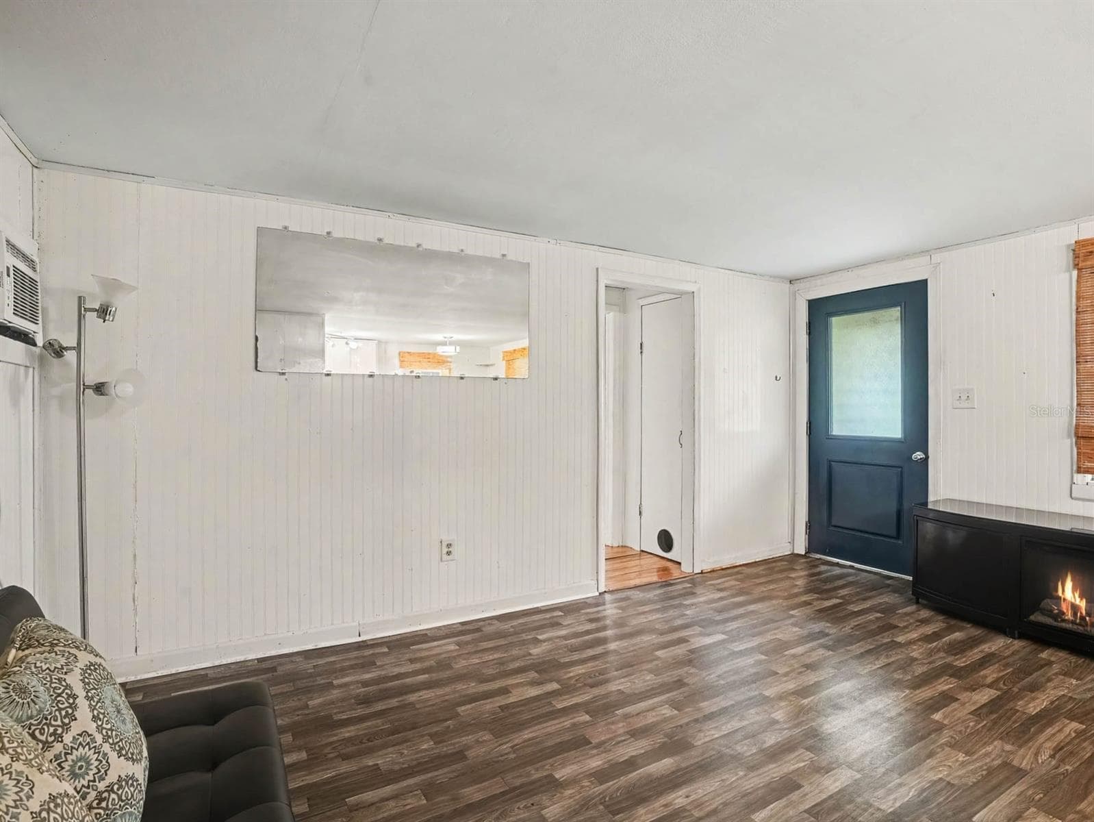 Open Living Area with Fireplace & Modern Flooring - 3015 STRAWBERRY LN, LAKELAND