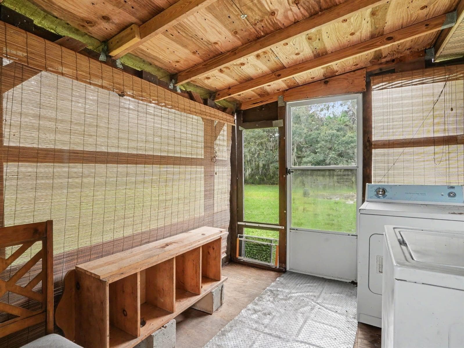 Utility Space: Washer, Dryer & Exposed Wood Beam Ceiling - 3015 STRAWBERRY LN, LAKELAND