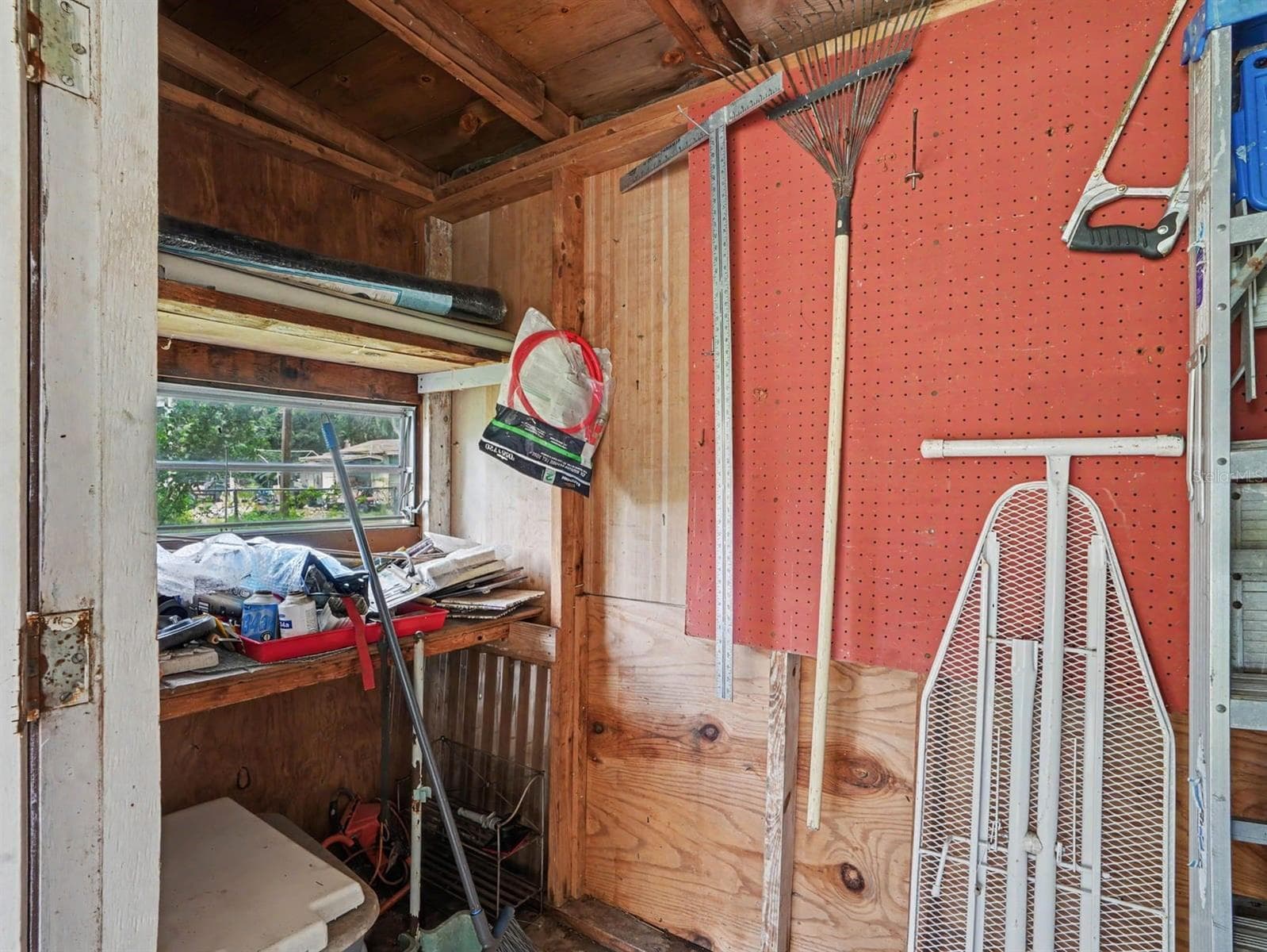 Workshop Storage with Pegboard Organization & Window View - 3015 STRAWBERRY LN, LAKELAND