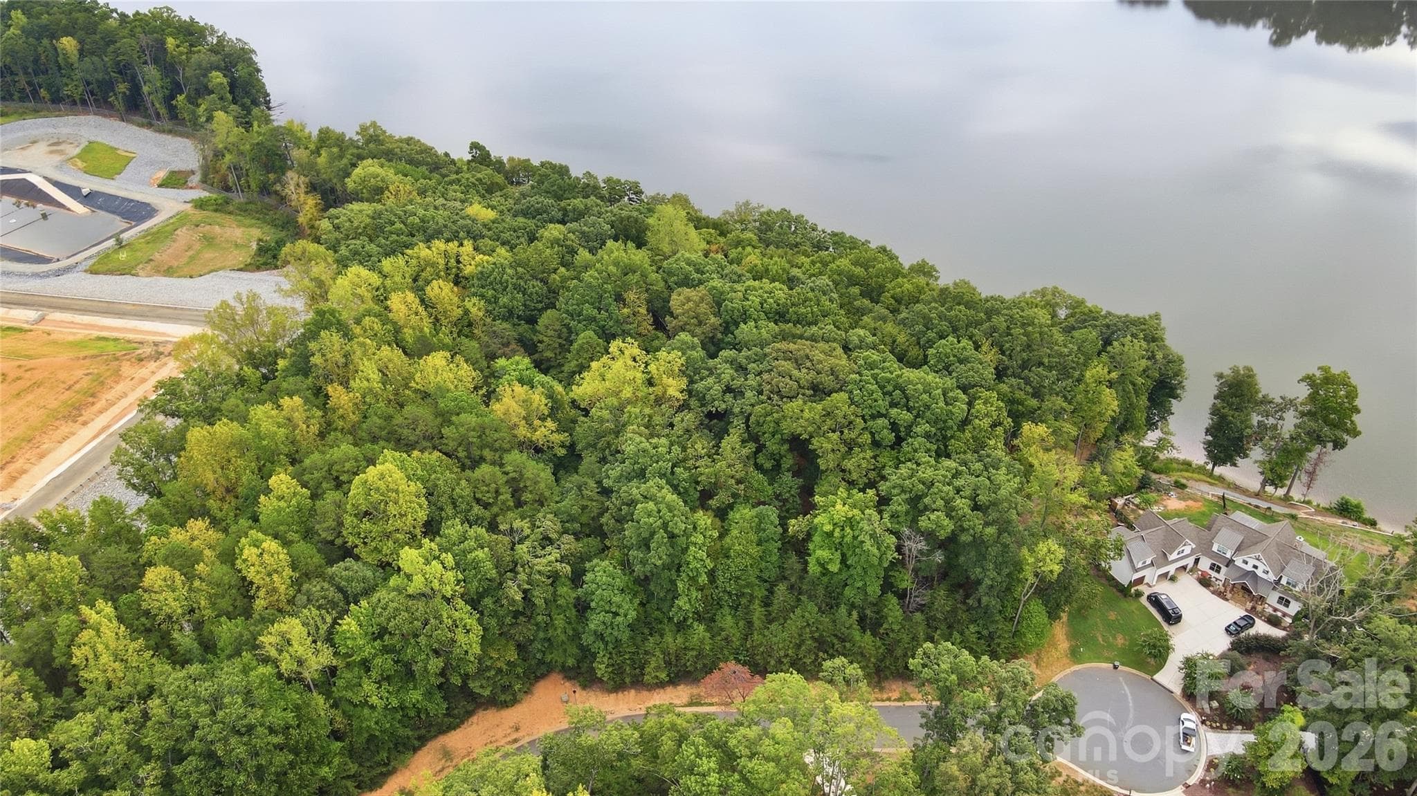 The property features beautiful mature hardwoods and abundant privacy - 1029 Nutall Oak Lane, Belmont