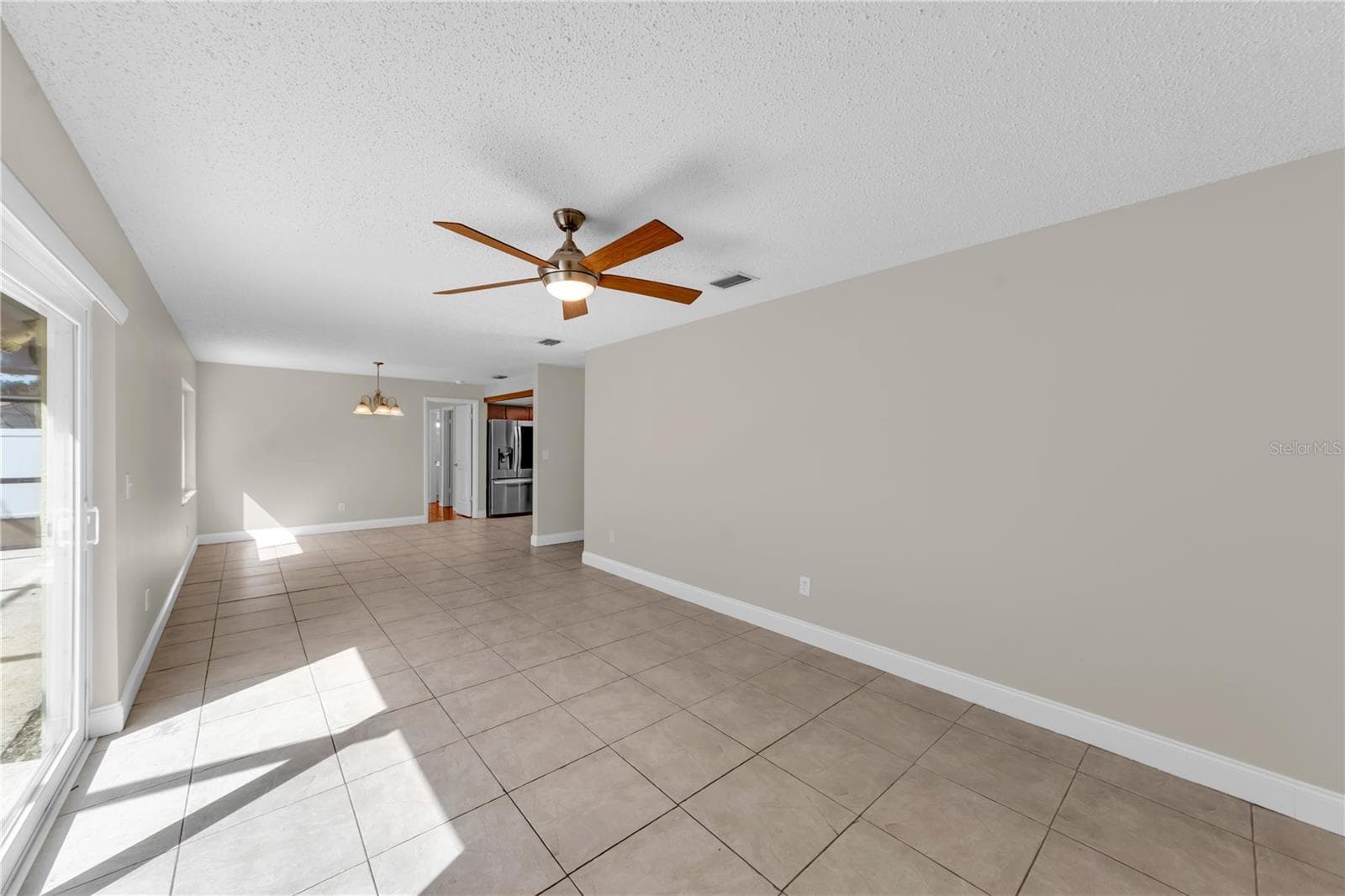 Living room with tile floors - 9602 HIDDEN OAKS CIR, TAMPA