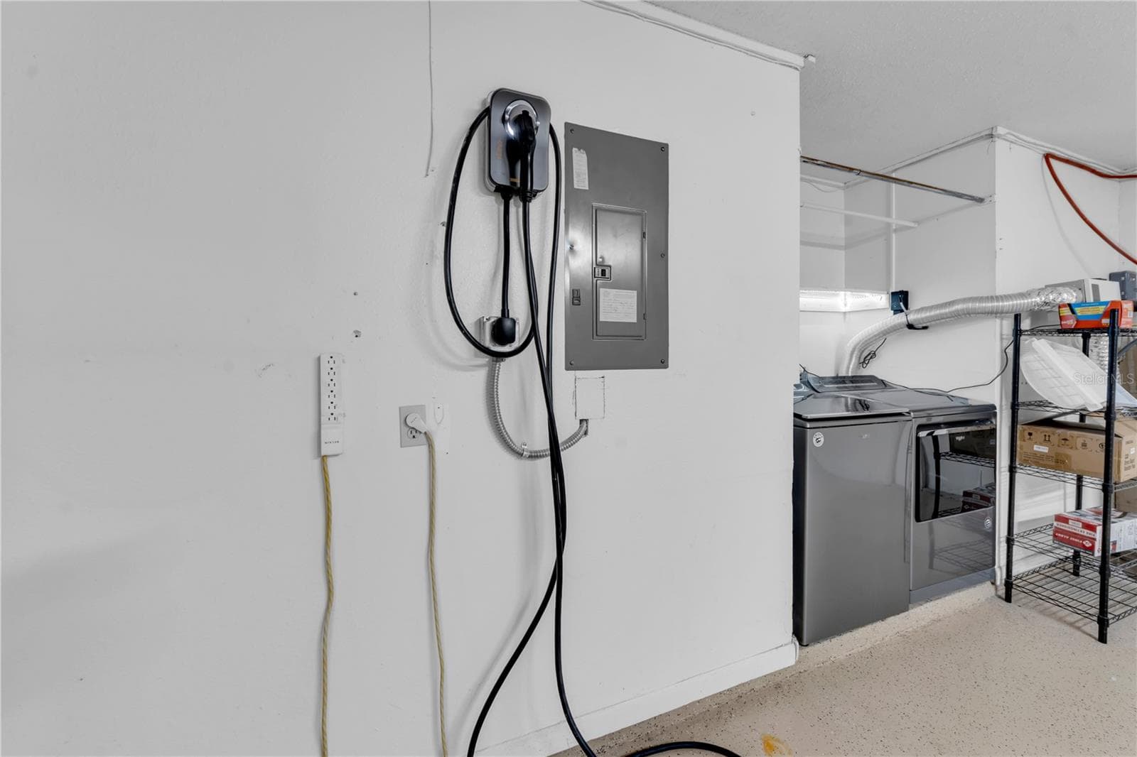 Electric vehicle charger in garage - 9602 HIDDEN OAKS CIR, TAMPA