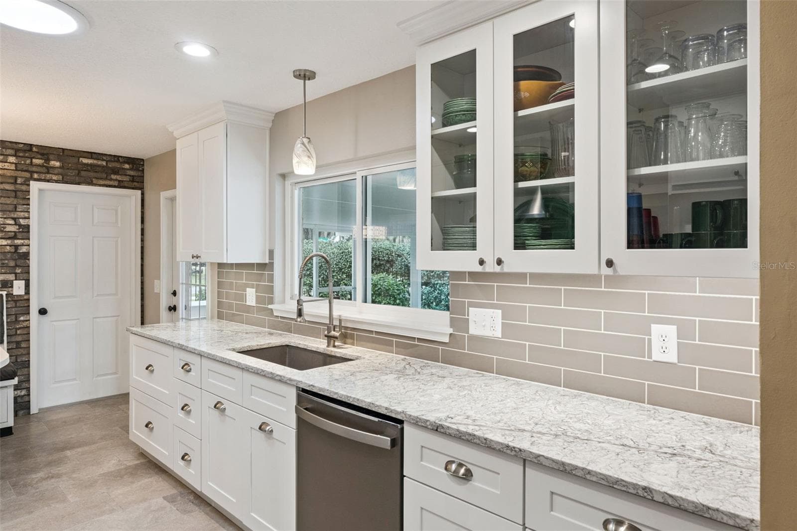 Accèss to the lanai and garage off the kitchen. - 698 SAUSALITO BLVD, CASSELBERRY