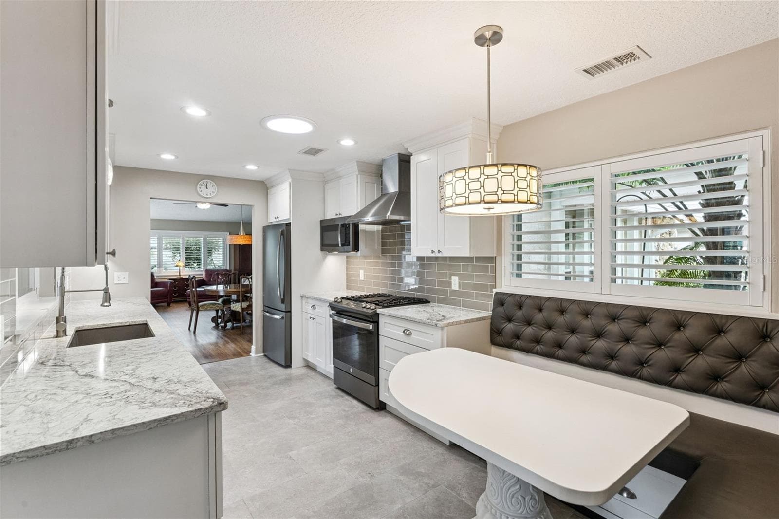 Additional features include a gas range and plantation shutters. - 698 SAUSALITO BLVD, CASSELBERRY