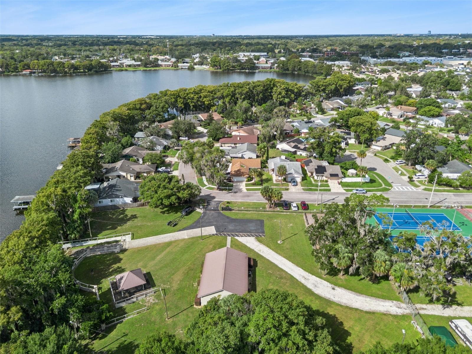 Clubhouse, pavilion, tennis courts and lake access is directly across the street! - 698 SAUSALITO BLVD, CASSELBERRY