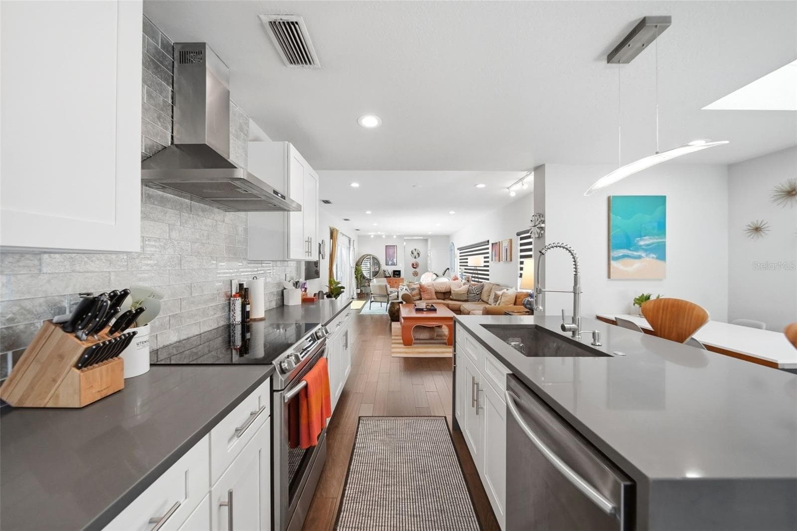 15 x 17 totally renovated kitchen with shaker cabinets, stainless appliances and vent hood. Counters and island are quartz. - 1221 SILVERSTONE AVE, ORLANDO