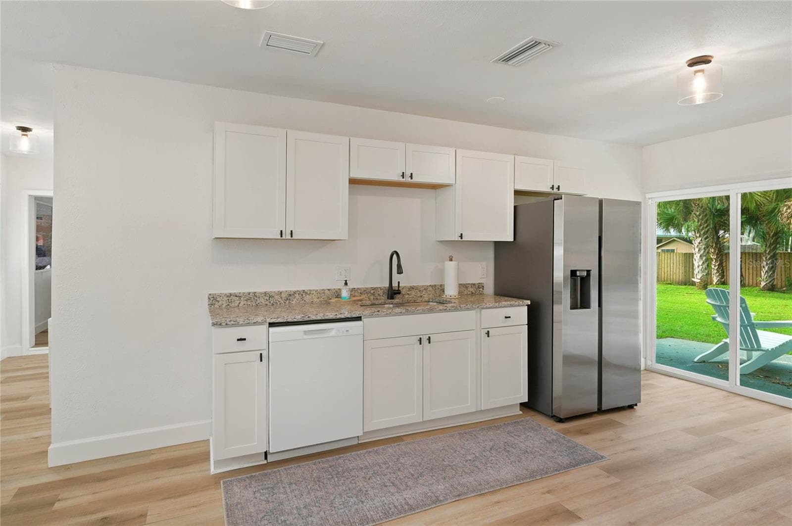 kitchen to outside patio - 556 OLIVER DR, NEW SMYRNA BEACH