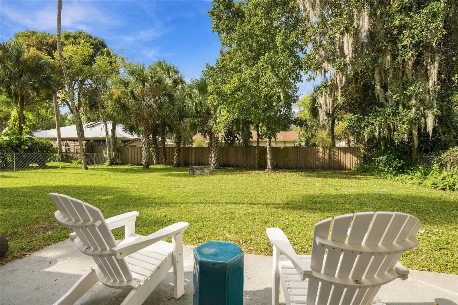 outside patio and huge fenced yard - 556 OLIVER DR, NEW SMYRNA BEACH