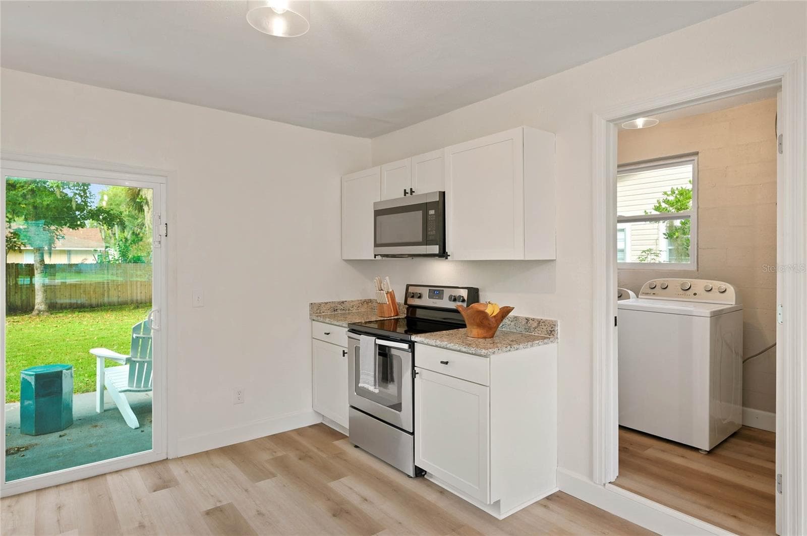 kitchen to laundry and storage space - 556 OLIVER DR, NEW SMYRNA BEACH
