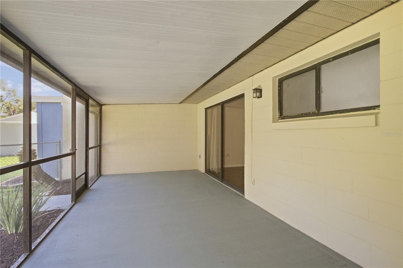 Back porch big enough for entertaining - 9911 LANCEWOOD ST, ORLANDO