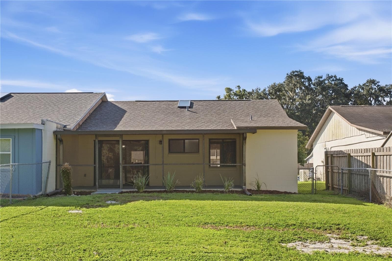 Rear of house - 9911 LANCEWOOD ST, ORLANDO