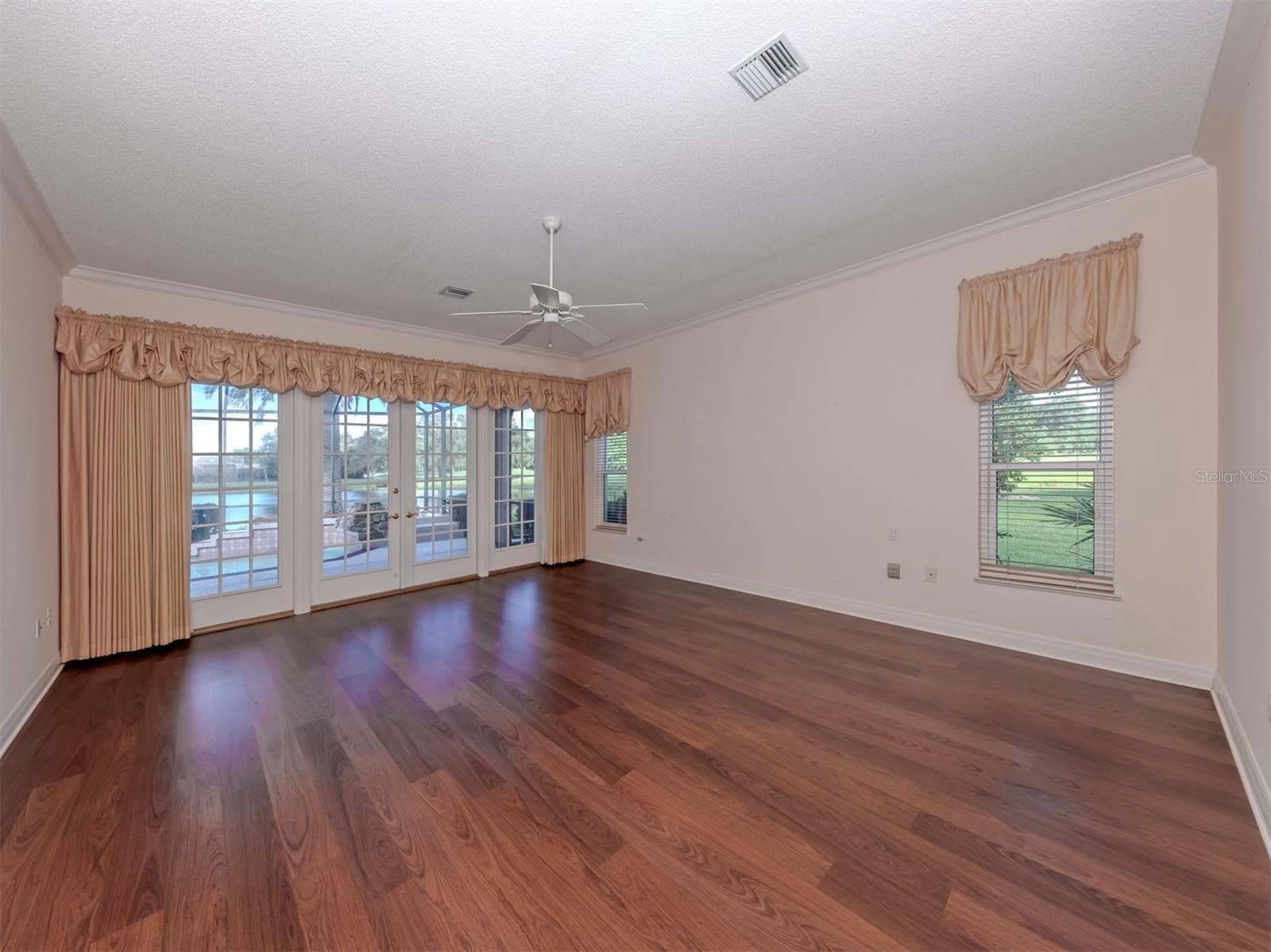 The primary suite includes dual walk in closets, private en-suite and french doors to access the lanai for late night dips - 1725 ARDRY WAY, VENICE