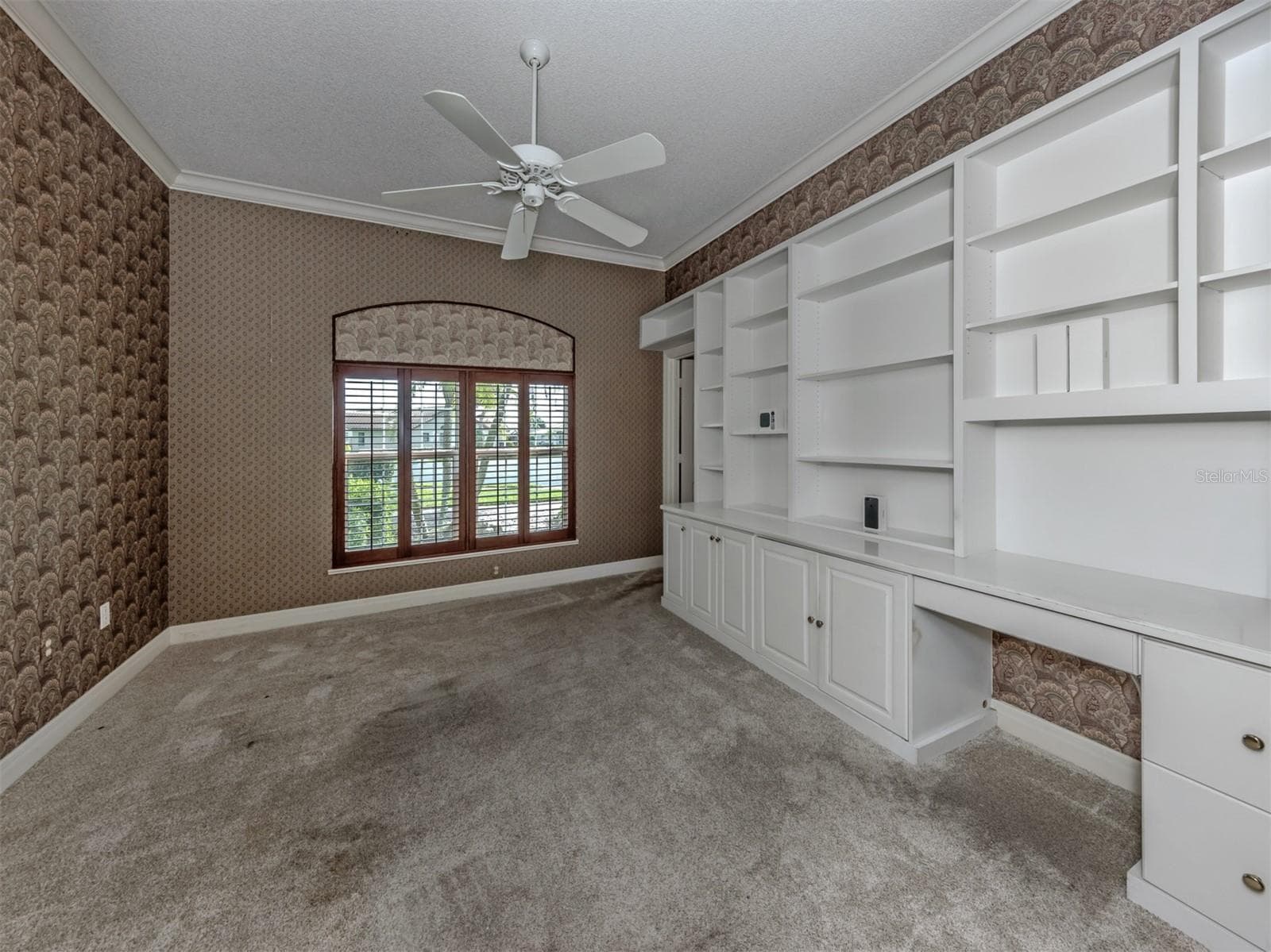 The large den includes double pocketing doors with built in cabinetry and private half bath with storage closet - 1725 ARDRY WAY, VENICE
