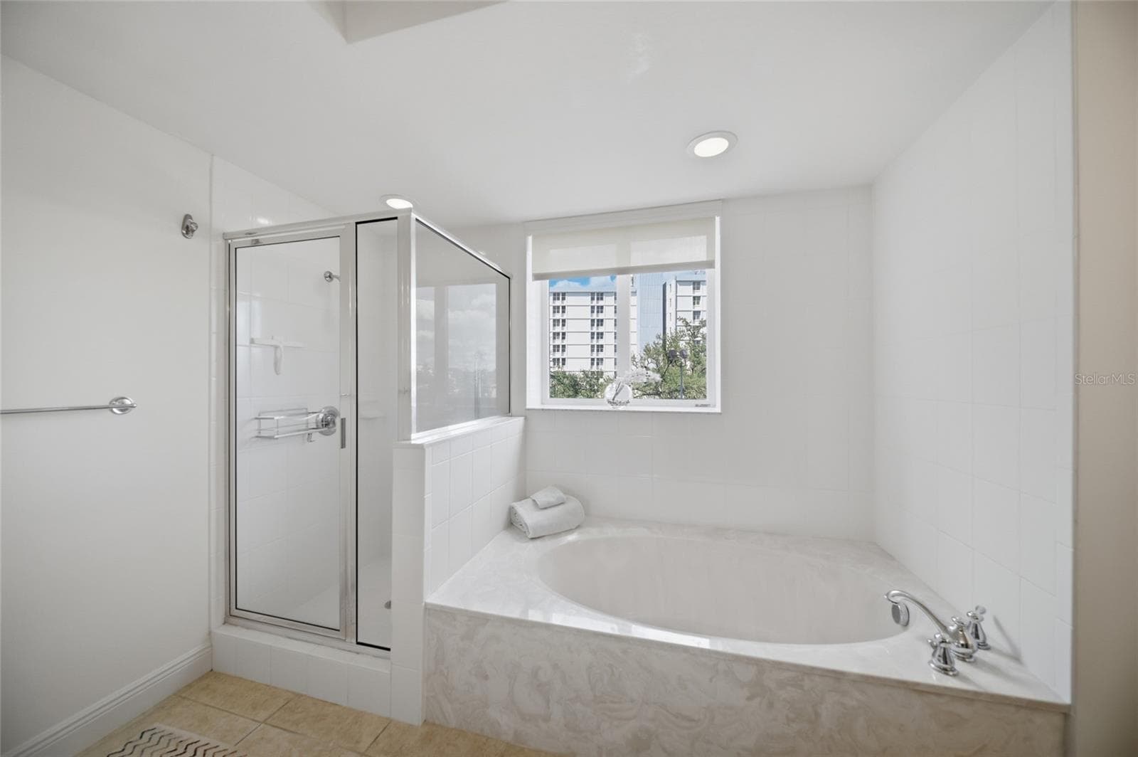 Primary bath with tub and shower - 800 N TAMIAMI TRL #201, SARASOTA