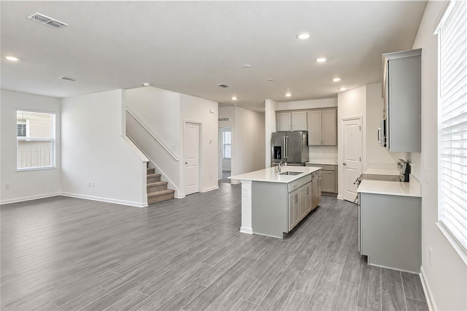 Dinette and Kitchen, Second Floor Stairs and Closet Door - 6459 PINE FORK ALY, ST CLOUD