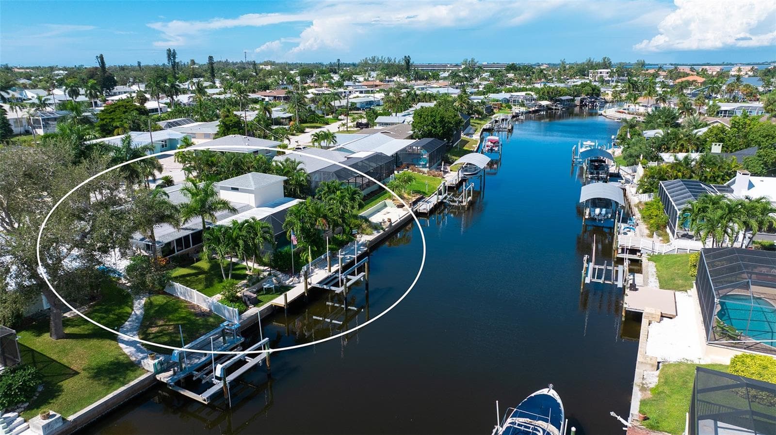 A rear aerial highlights the home and its canal-side setting. - 4907 CORAL BLVD, BRADENTON