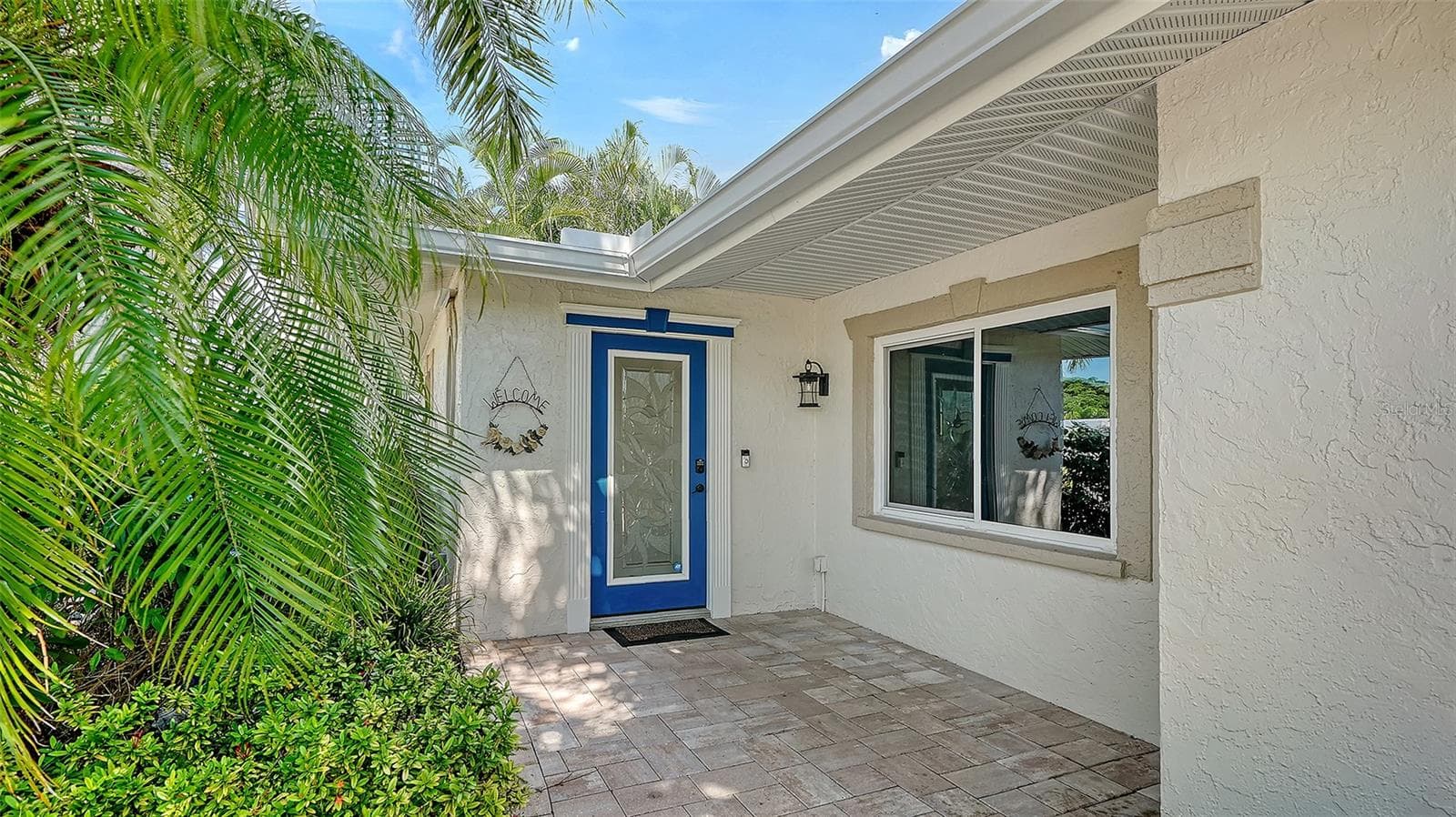 A sheltered entry welcomes you home from a day on the water. - 4907 CORAL BLVD, BRADENTON
