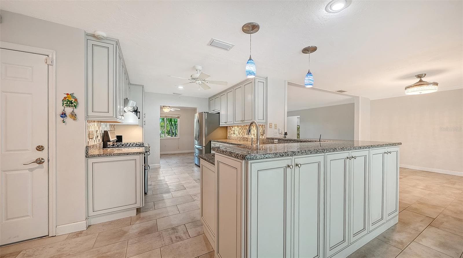 A welcoming kitchen at the center of your gatherings. - 4907 CORAL BLVD, BRADENTON