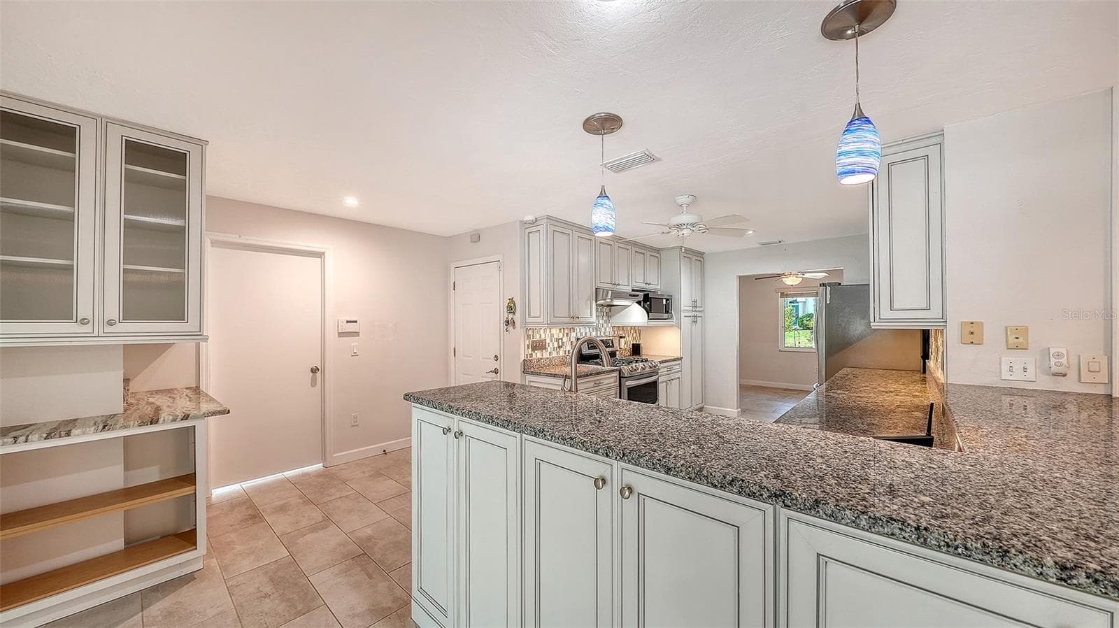 Counter seating space keeps conversation close to the cook. - 4907 CORAL BLVD, BRADENTON