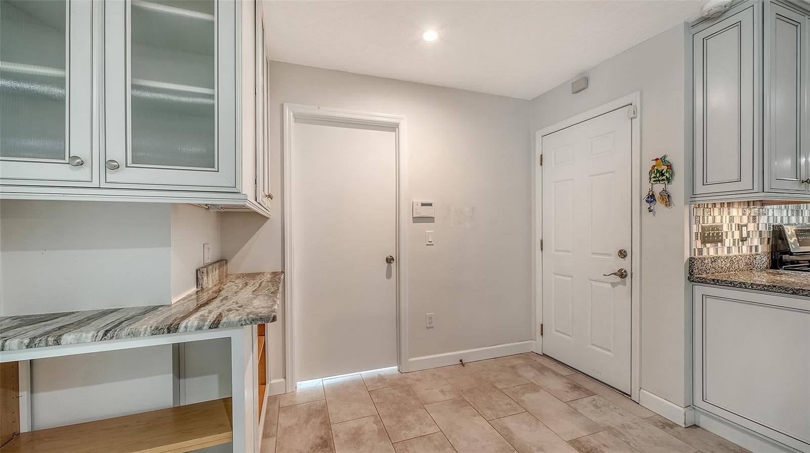 Additional kitchen storage keeps essentials close at hand. - 4907 CORAL BLVD, BRADENTON