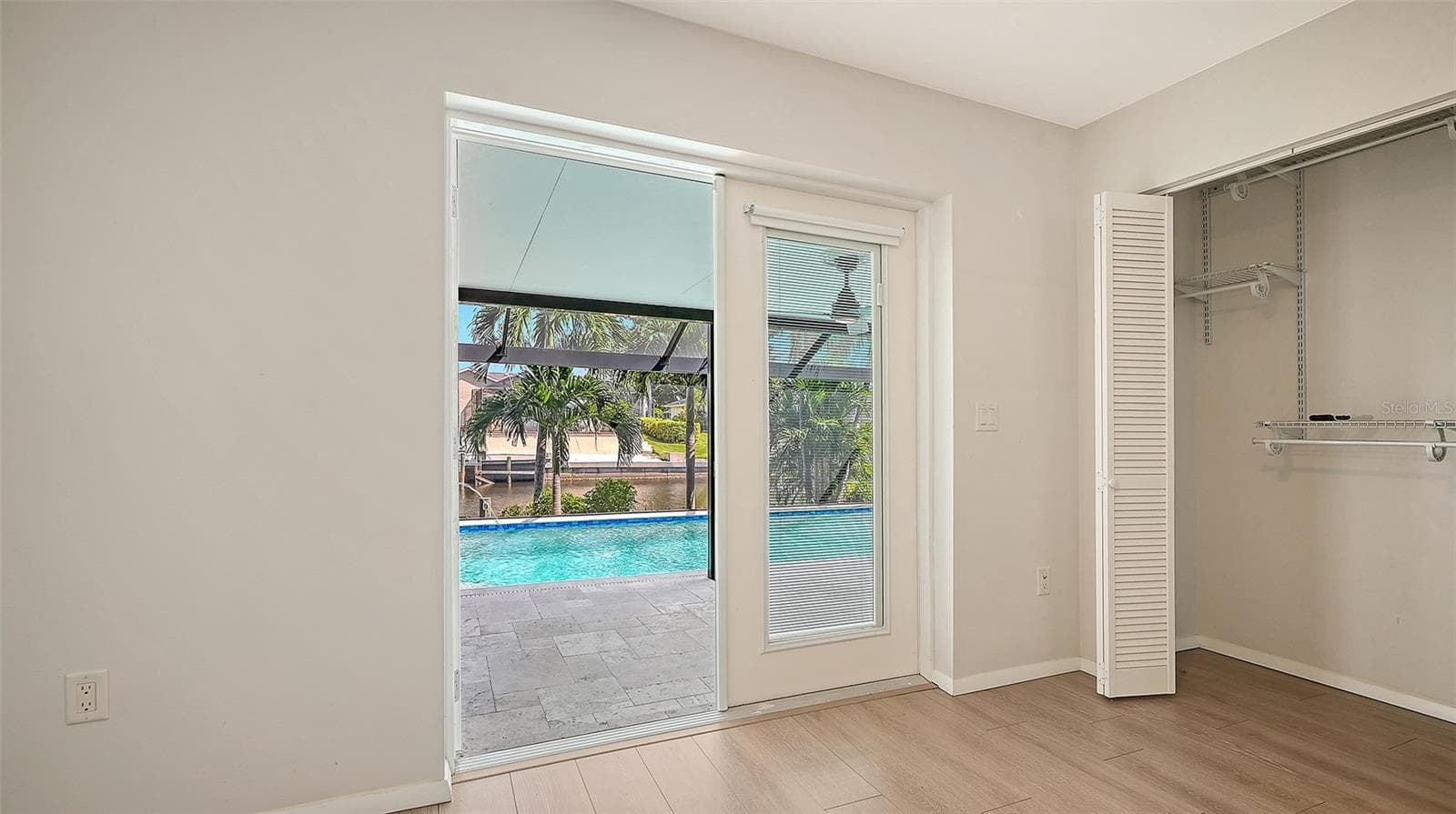 Step toward the pool from this bright bedroom retreat. - 4907 CORAL BLVD, BRADENTON