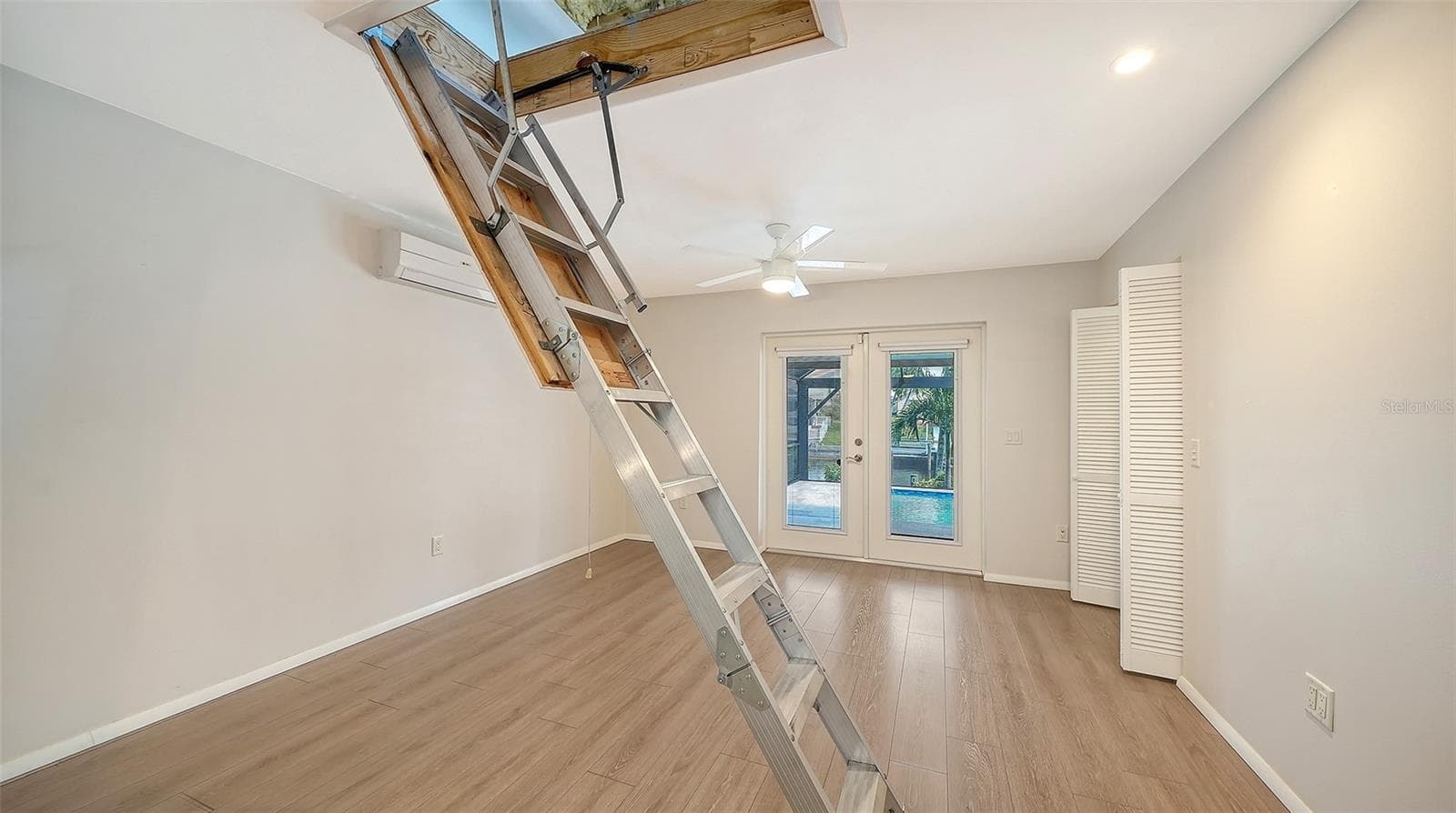 Pull-down stairs provide access to the overhead storage area. - 4907 CORAL BLVD, BRADENTON