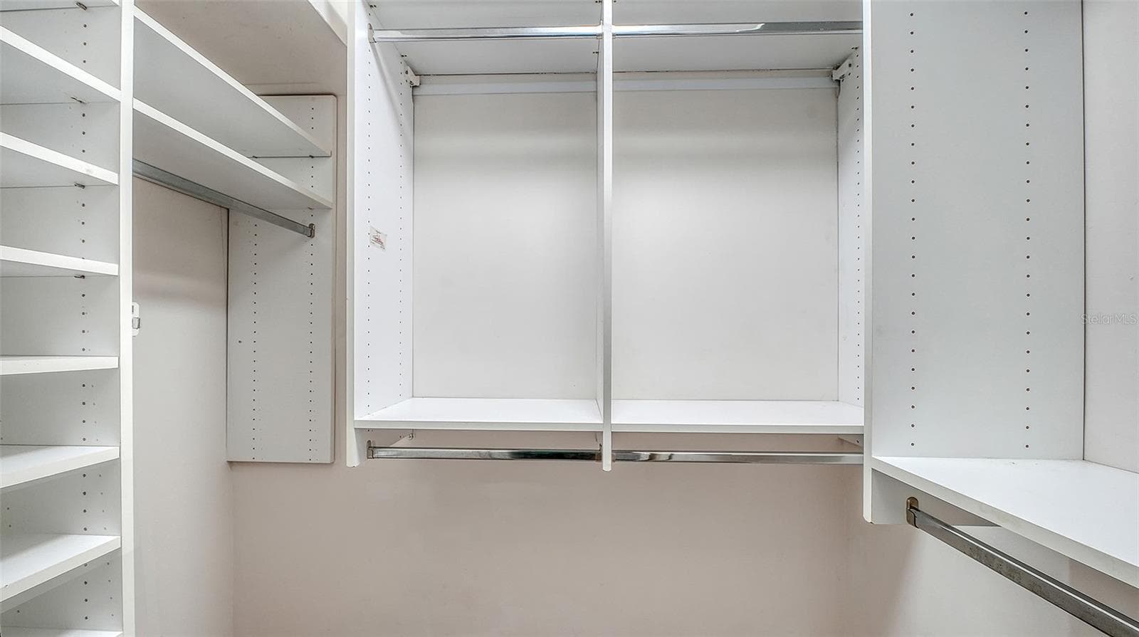 Organized closet shelving keeps your wardrobe within reach. - 4907 CORAL BLVD, BRADENTON