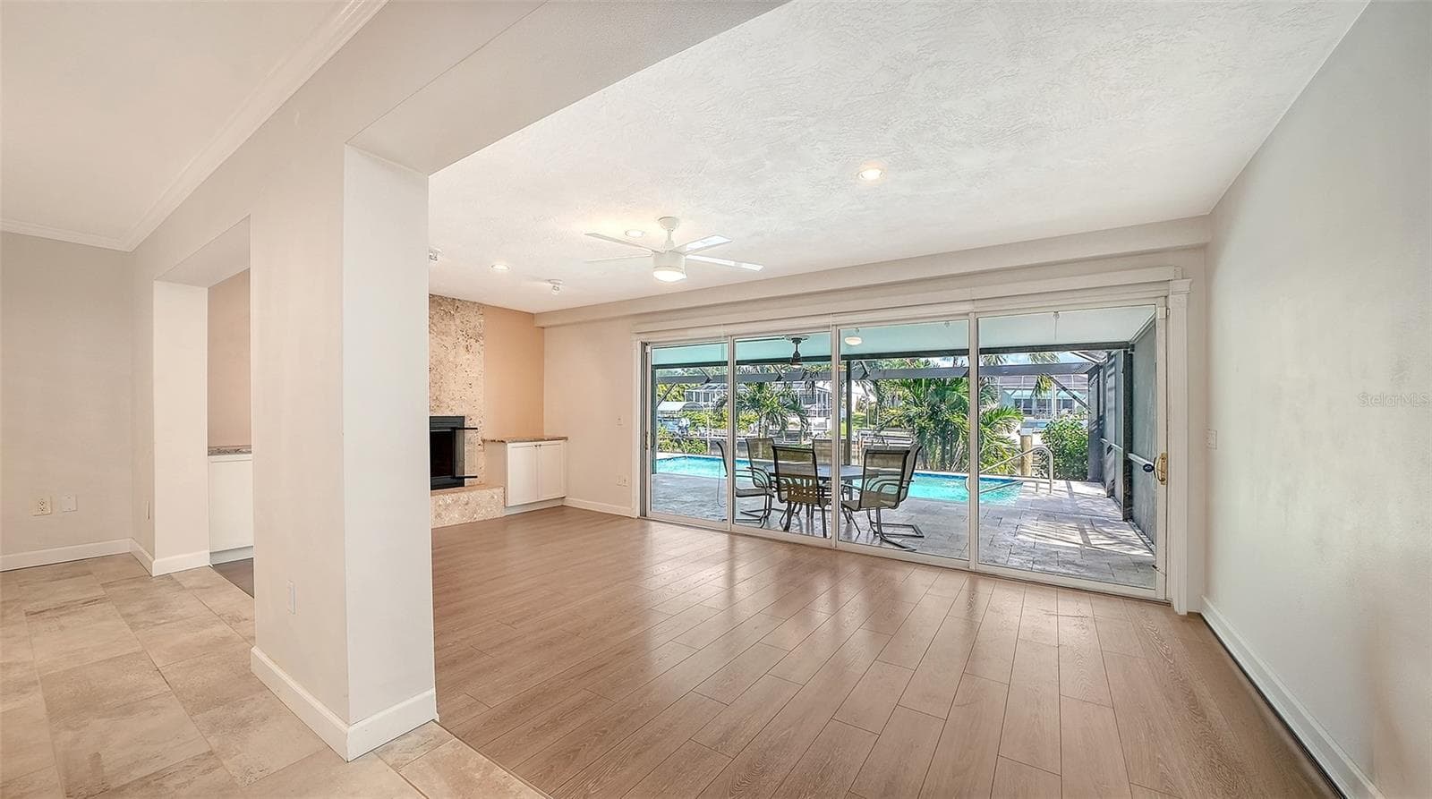 Open the living space to shaded poolside dining. - 4907 CORAL BLVD, BRADENTON