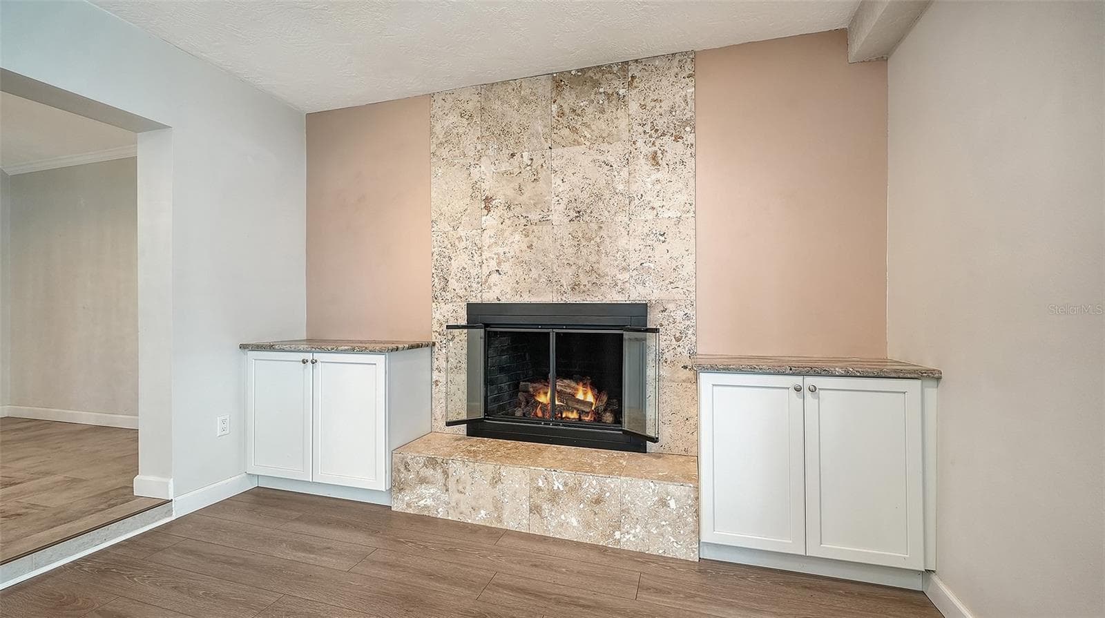 A fireplace feature wall creates a natural gathering spot. - 4907 CORAL BLVD, BRADENTON