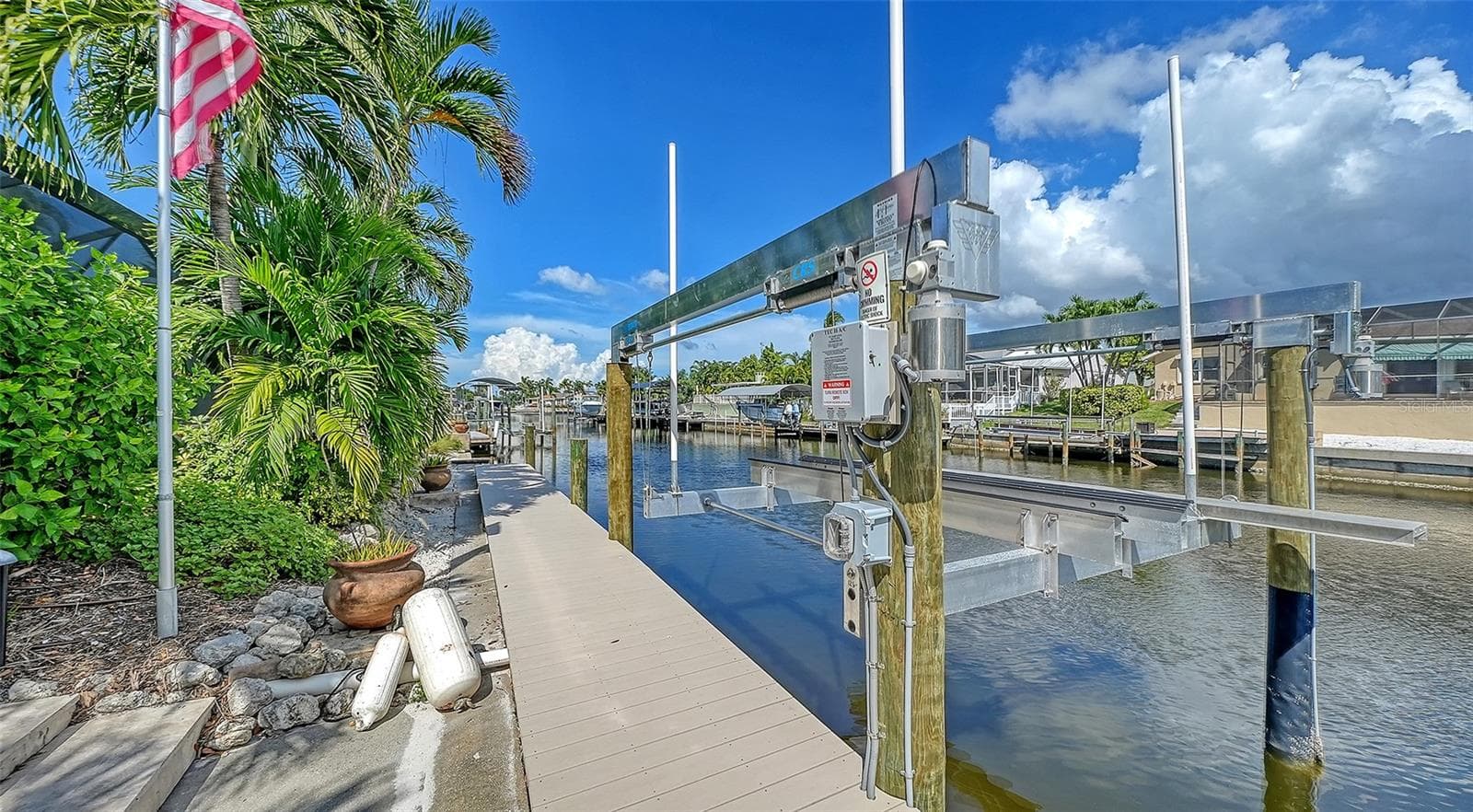 Keep boating adventures close with your waterfront dock and lift. - 4907 CORAL BLVD, BRADENTON