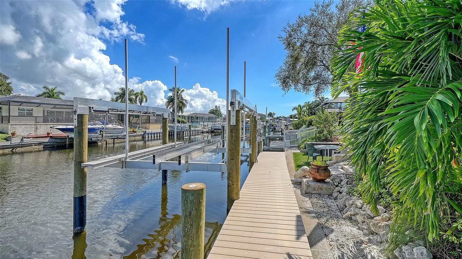 A dockside walkway brings you closer to the water. - 4907 CORAL BLVD, BRADENTON