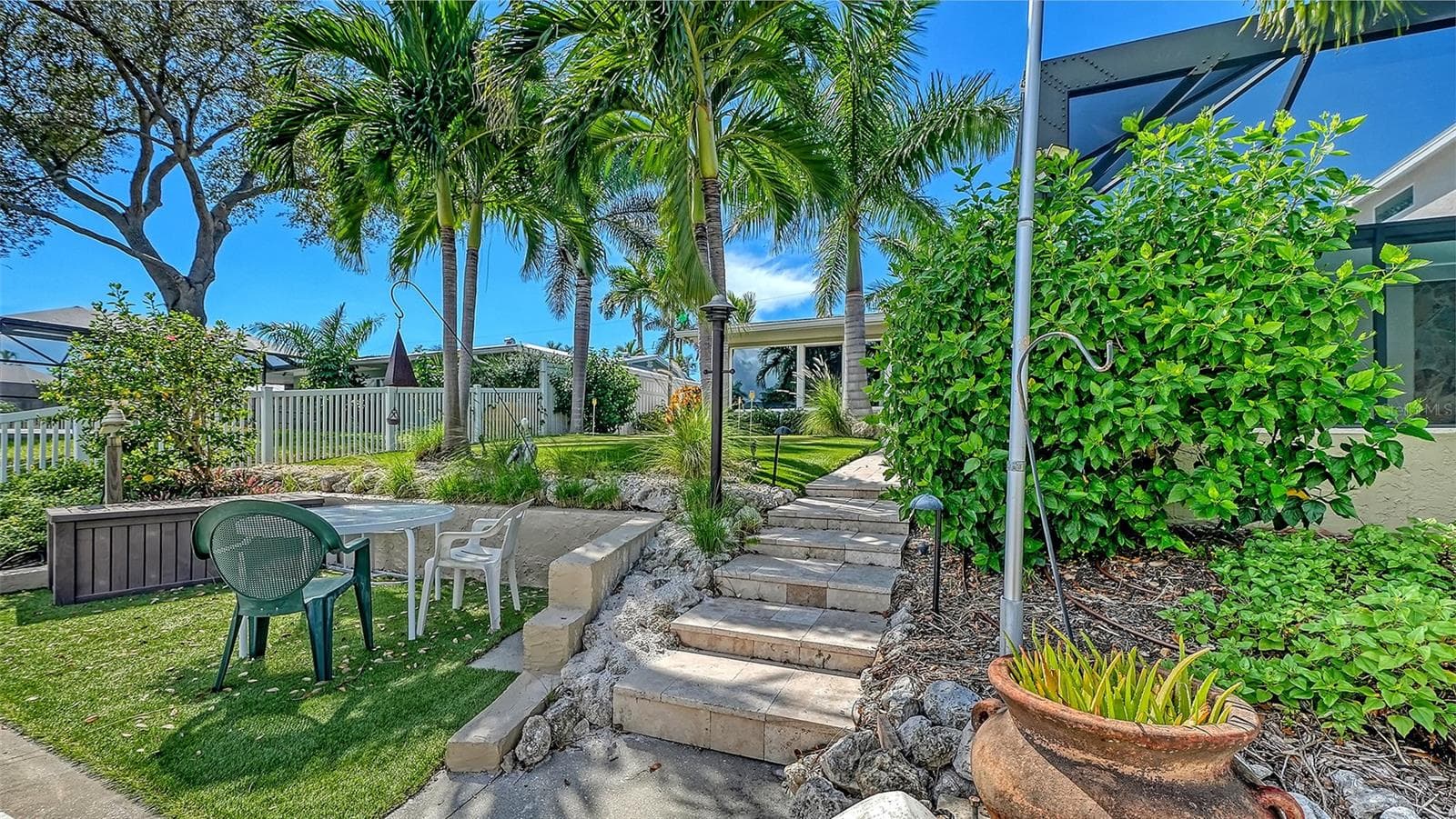 Follow the garden steps from the waterfront to the backyard. - 4907 CORAL BLVD, BRADENTON