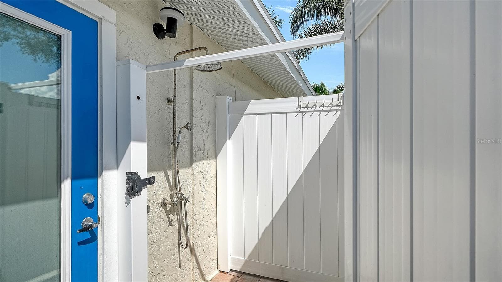An outdoor shower offers a convenient rinse after pool time. - 4907 CORAL BLVD, BRADENTON