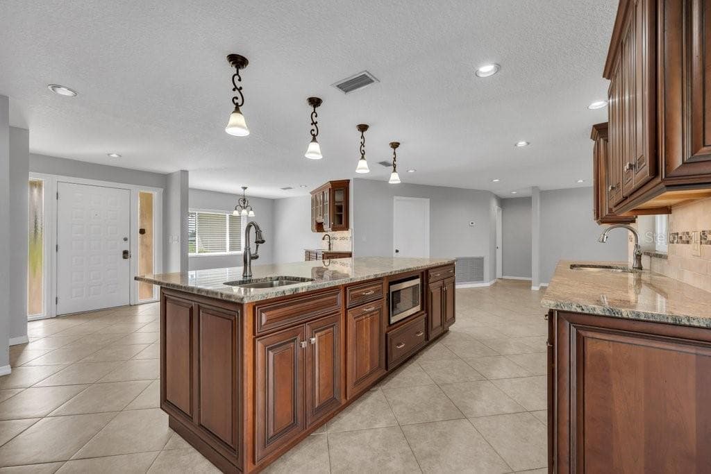 View of the front door from the kitchen. - 5710 WO GRIFFIN RD, PLANT CITY