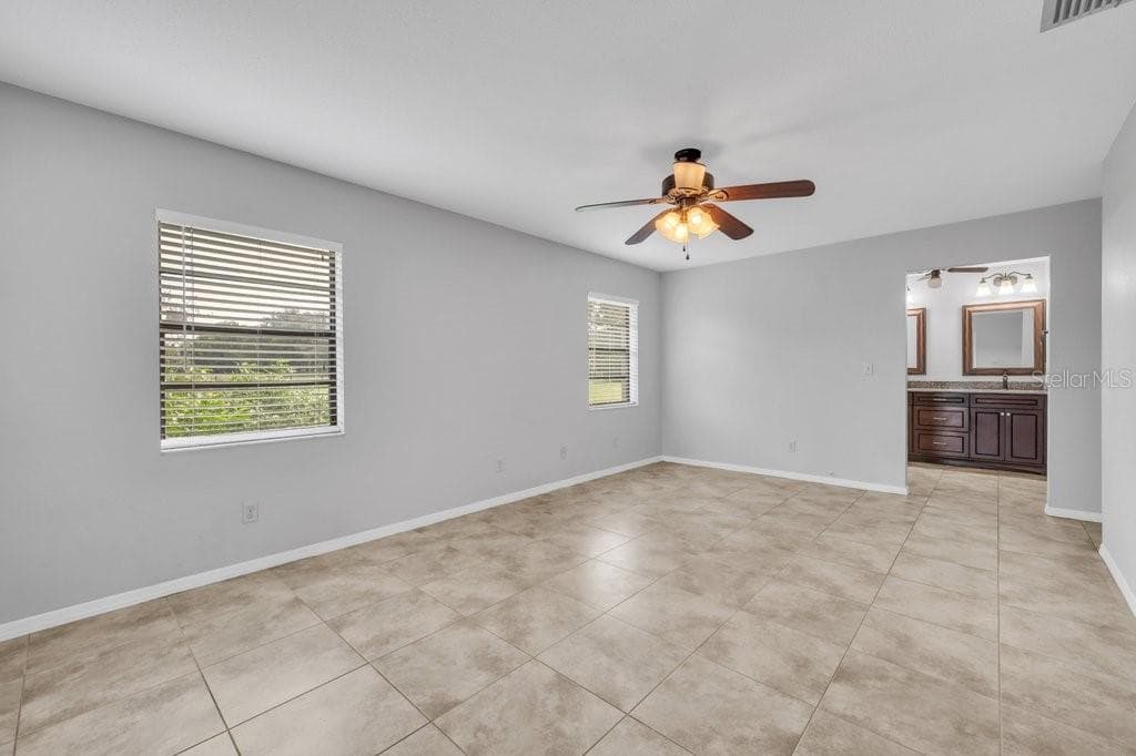 Primary bedroom looking toward the ensuite and walk in closet - 5710 WO GRIFFIN RD, PLANT CITY