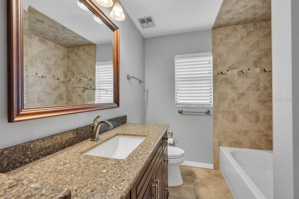 Bathroom 2 with tub and shower - 5710 WO GRIFFIN RD, PLANT CITY